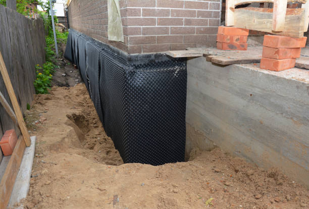 Happy homeowners after waterproofing job in Addison